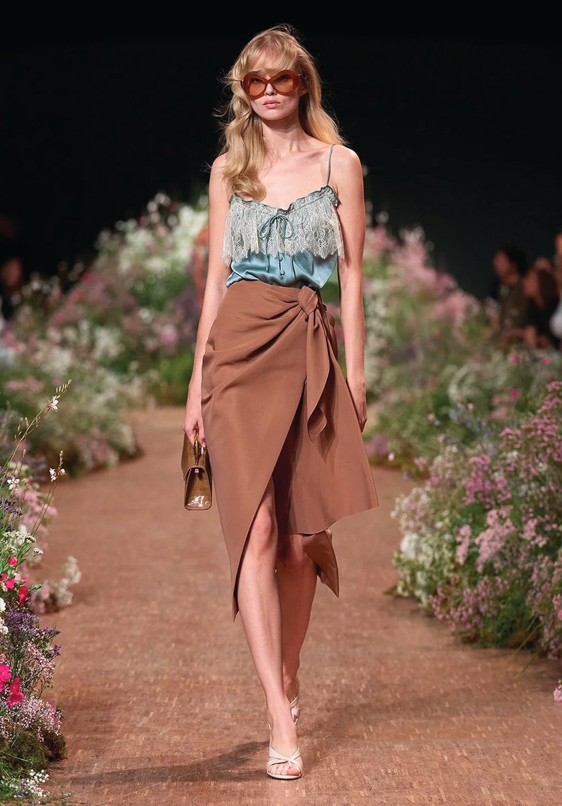 Elie Saab Spring/Summer 2027, Look 10 Model in a teal lace camisole and wrapped brown skirt at Elie Saab Spring/Summer 2027