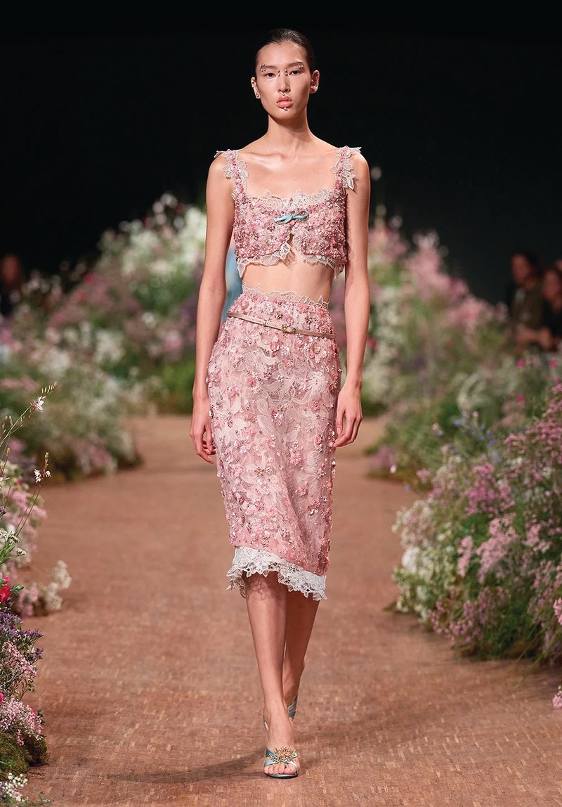 Elie Saab Spring/Summer 2027, Look 4 Model in a pink lace bralette and matching skirt at Elie Saab Spring/Summer 2027