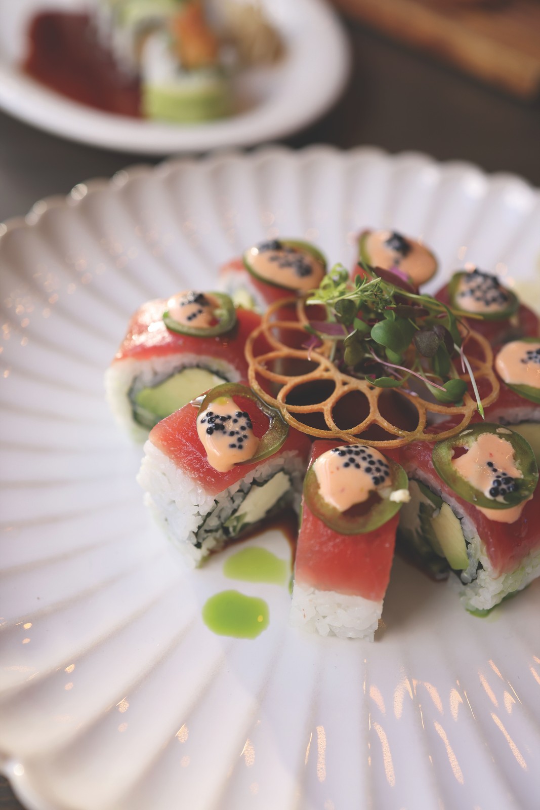 Starry Nights – Crudo Delicately arranged crudo on a white textured plate